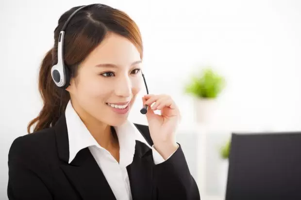 young beautiful businesswoman with headset in office